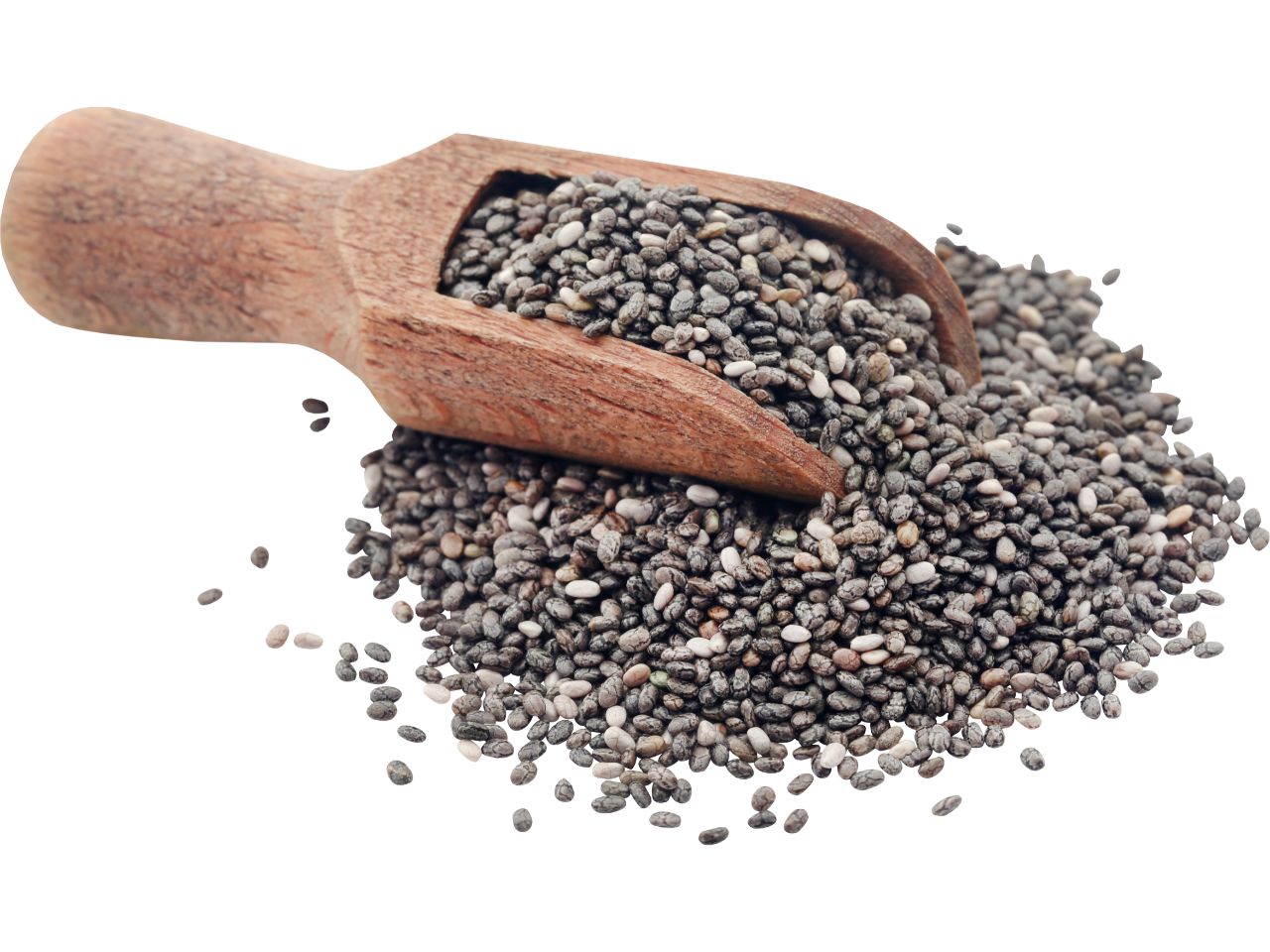 Chia seeds in a wooden scoop, spilling onto a white surface.