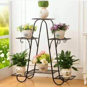 Decorative black metal plant stand with potted flowers and greenery on multiple tiers.