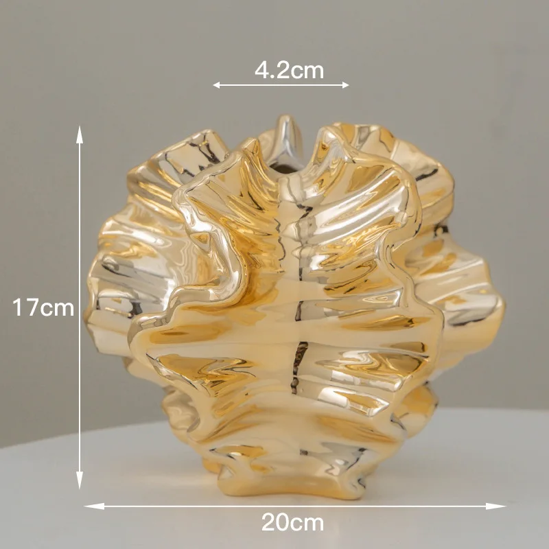 Gold ceramic vase with a ruffled, flower-like design, dimensions 17cm height, 20cm width, 4.2cm opening.