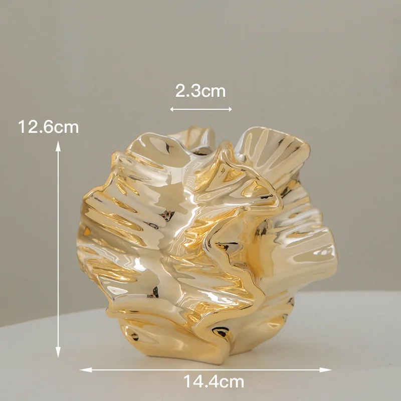 Gold ceramic vase with a unique, crumpled design. Height: 12.6cm, Width: 14.4cm, Opening: 2.3cm.
