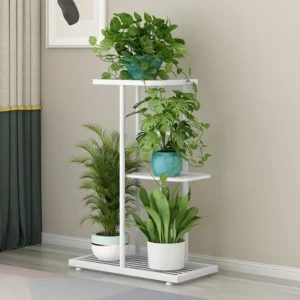 White tiered plant stand with various potted plants, adding greenery to the home.