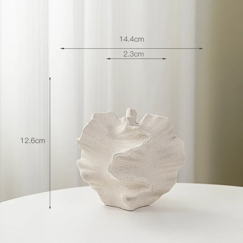 Modern ceramic vase with a unique, textured design. Minimalist home decor.