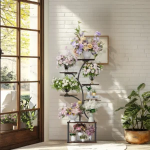 Multi-tiered flower stand with colorful bouquets against a white brick wall near a sunlit doorway.