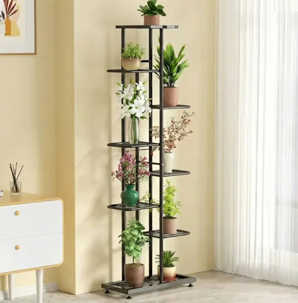 Tall, 8-tier black plant stand displaying various potted plants indoors.